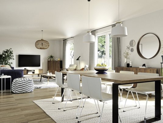 Wohnzimmer im Mitwachshaus Flair 148 Großzügiges Wohnzimmer im Massivhaus Flair 148 mit offener Raumgestaltung und gemütlicher Einrichtung. Beispiel für Wohnqualität aus Stein.