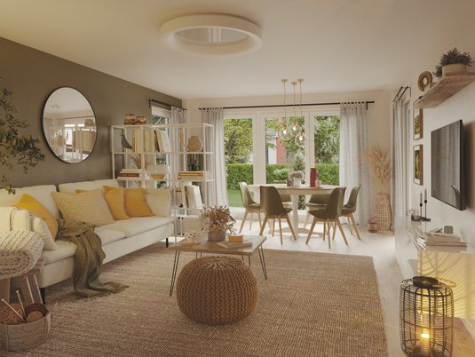 Wohnzimmer im Bungalow 128 mit Sofalandschaft und großem Fenster, Sinnbild für Geborgenheit und modernen Wohnkomfort