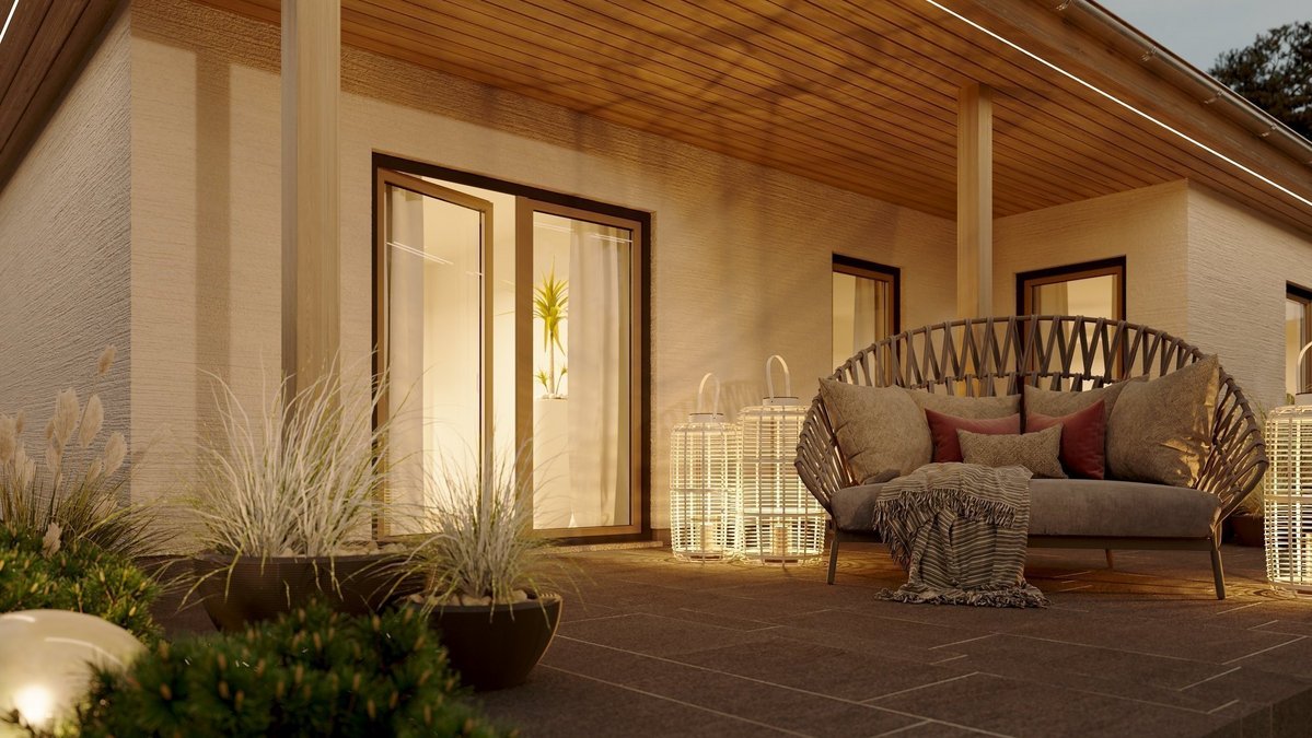 Nahaufnahme eines modernen Bungalows 128 in Abendstimmung mit direktem Blick auf die Terrasse - Massivhaus von MP Projektmanagement