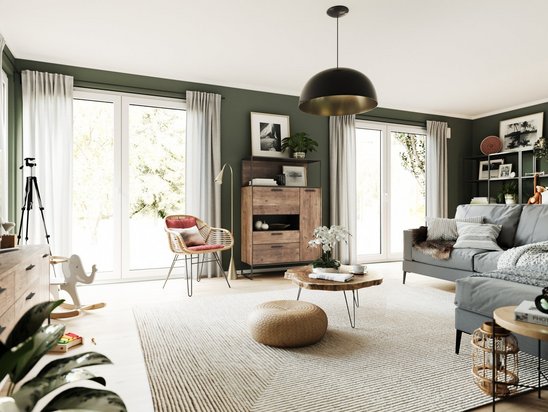 Helles Wohnzimmer im Massivhaus Flair 152 RE mit großen Fenstern und moderner Einrichtung. Ideal für energieeffizientes und komfortables Wohnen.
