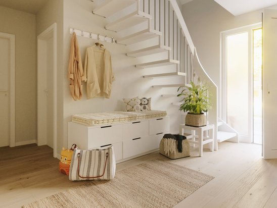 Heller Eingangsbereich mit Treppe und freundlicher Atmosphäre vermittelt Sicherheit und Wohnkomfort beim Hausbau in NRW